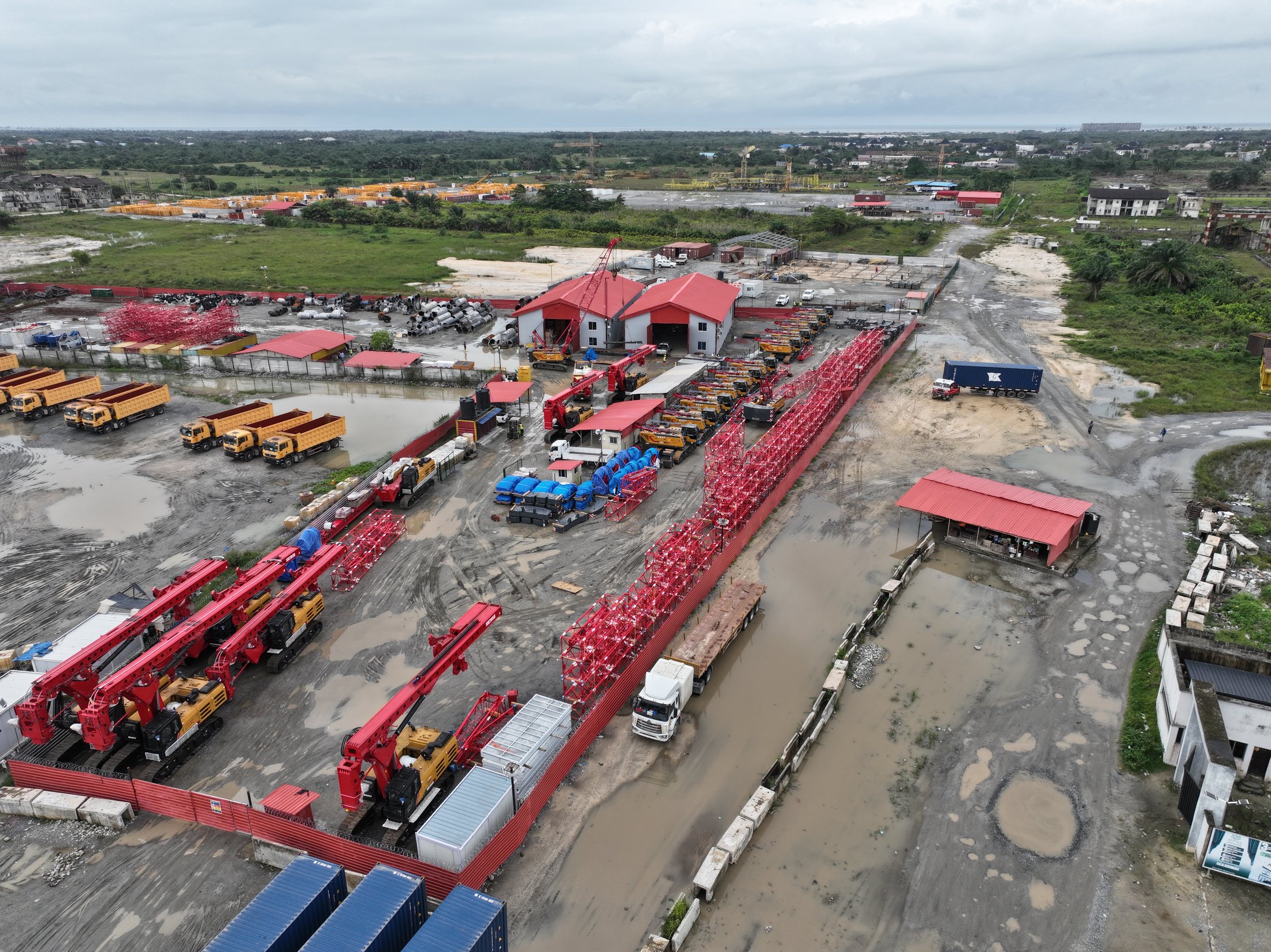 Aerial view of cranes and lifting equipment arranged in the plant yard