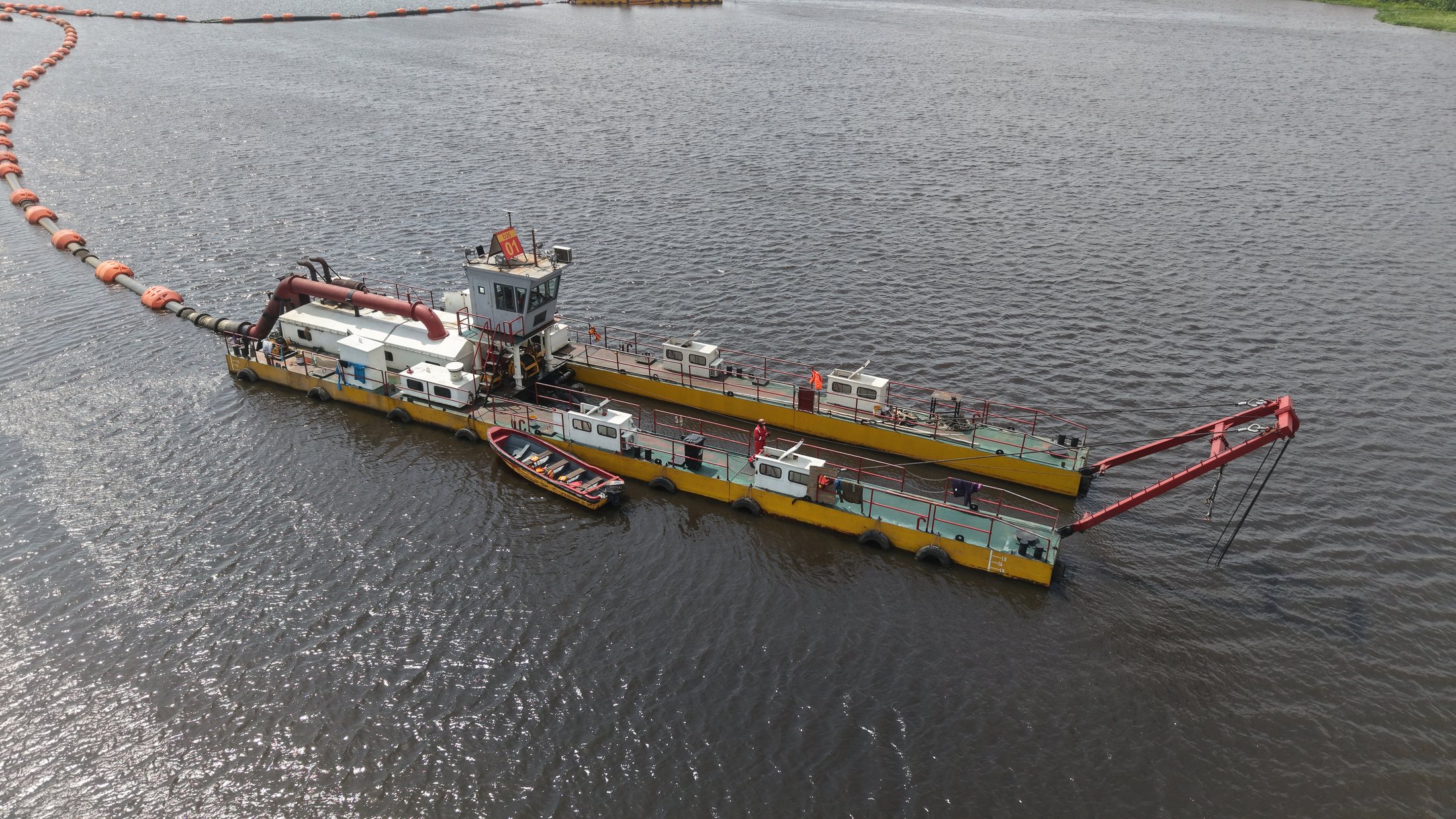 Dredging and marine plant operating on the water