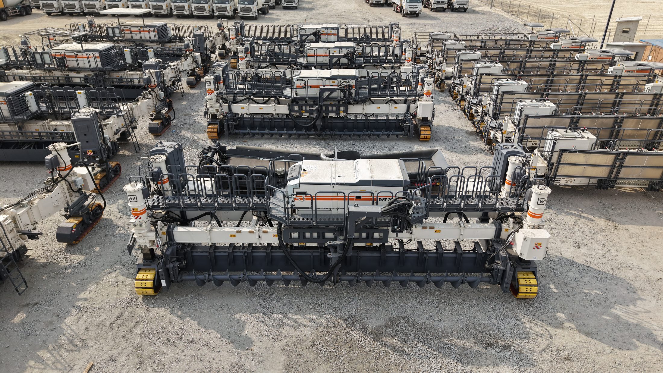 Wirtgen WPS wheel pavers and trimmers staged at the coastal yard