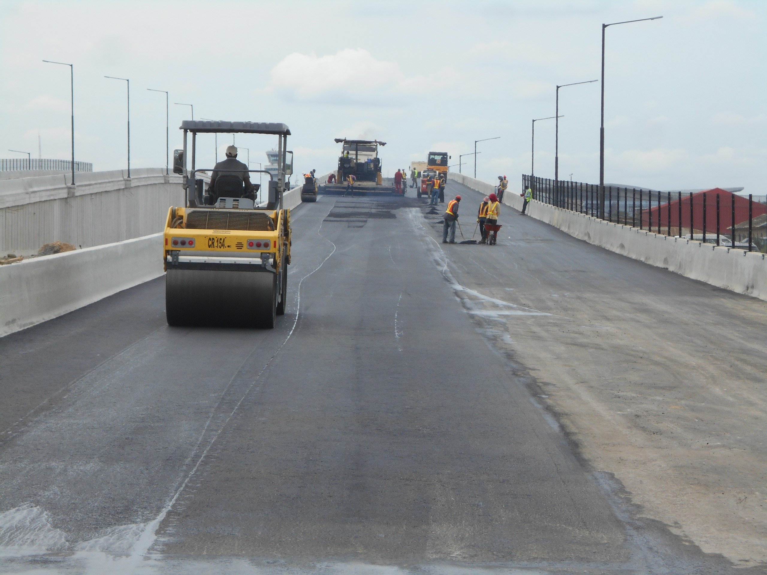 Active paving operation on the Airport Road Construction project in Lagos