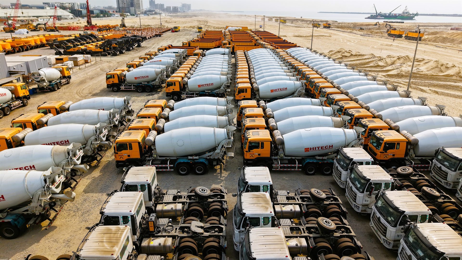 Concrete paving equipment and support fleet working along a Hitech corridor