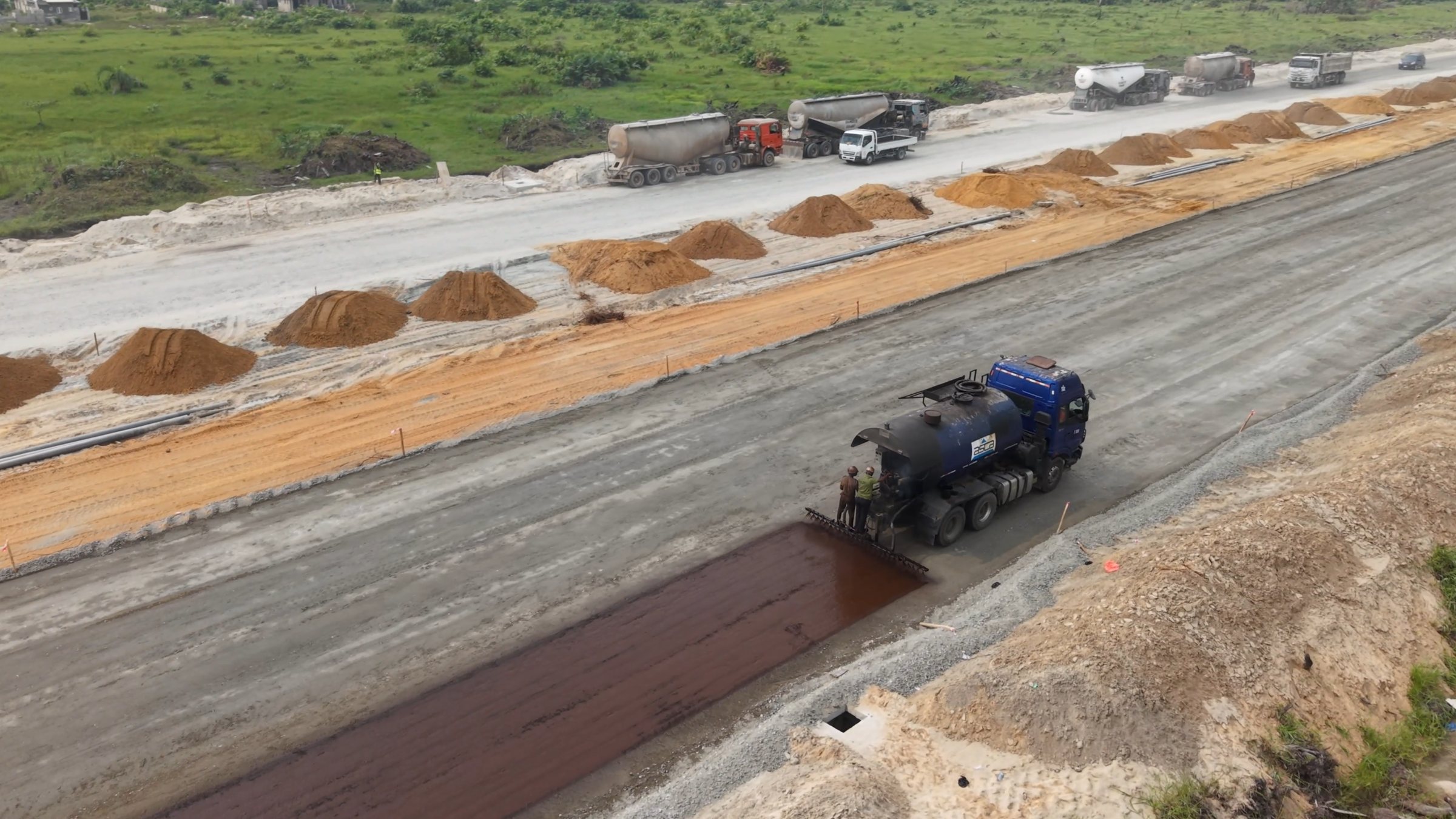 Aerial view of MC1 bitumen priming works on a prepared road layer