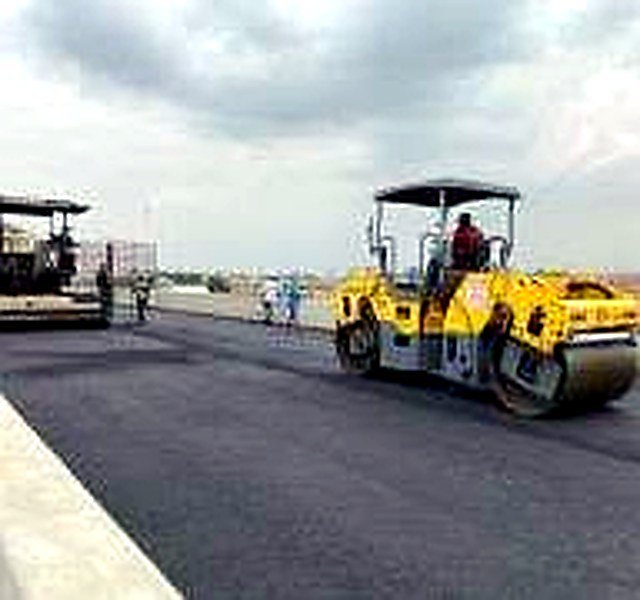 Road-layer processing equipment operating on the Lagos-Calabar Coastal Highway